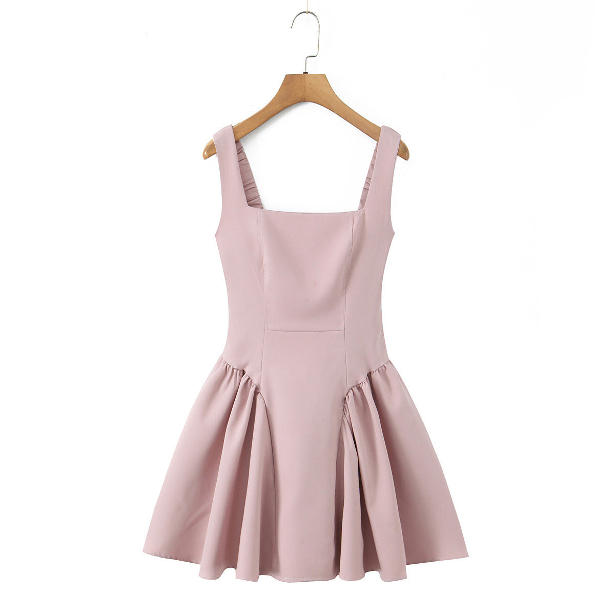 Spicy girl with shoulder straps and pleated dress