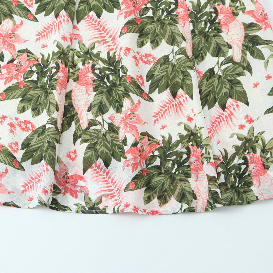 Getailleerde jurk met bloemenprint ceintuur en strikbandjes