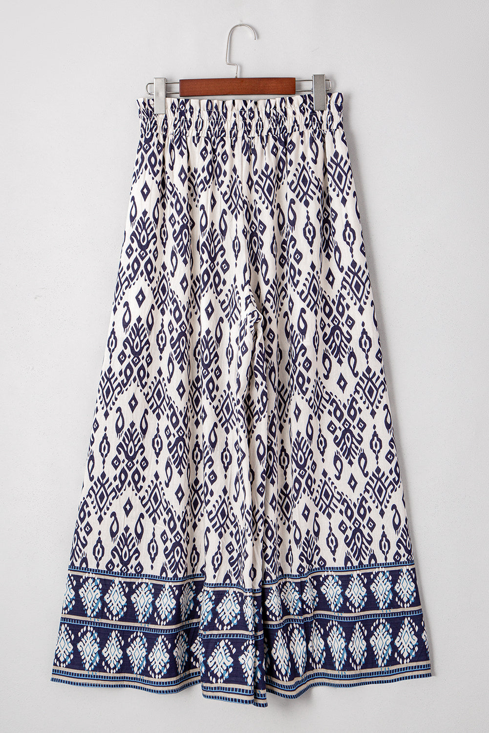 Blauwe broek met etnische print hoge taille en wijde pijpen losse pasvorm