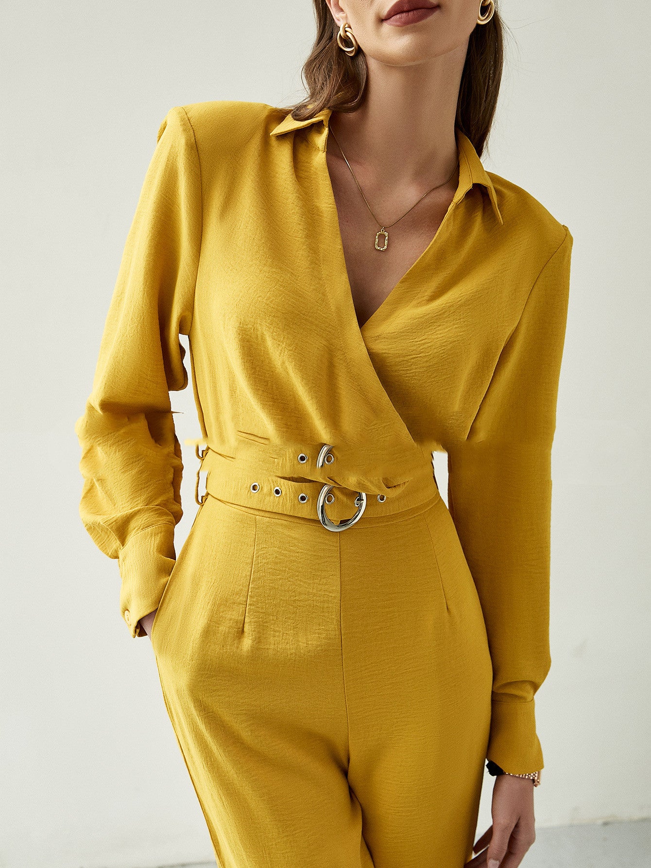 Lange mouwen riem V-hals losse jumpsuit