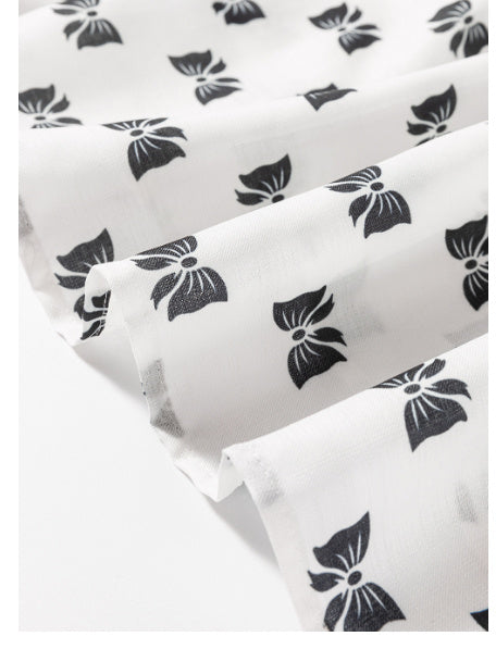 Witte blouse met bies strikprint en ronde hals