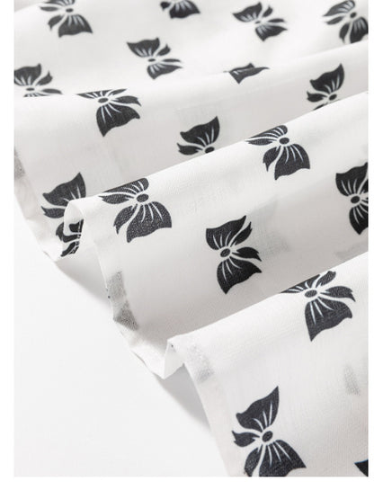 Witte blouse met bies strikprint en ronde hals