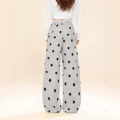 Dames joggingbroek met all-over sterren print wijde pijpen in een relaxte stijl