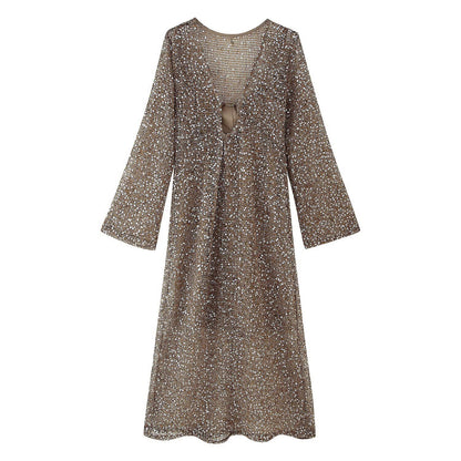 Damesjurk met pailletten en gehaakt design