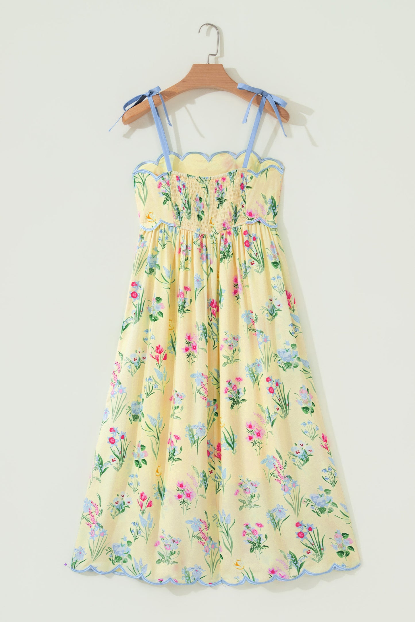Roze midi-jurk met bloemenprint contrasterende bies strikbandjes en hoge taille