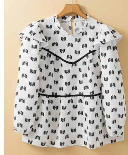 Witte blouse met bies strikprint en ronde hals