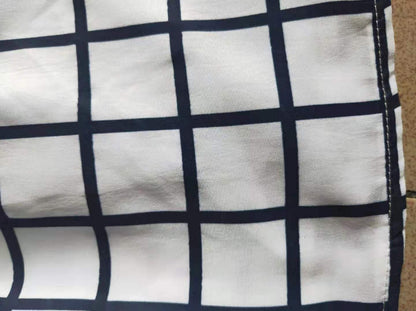 Baby blauwe geruite jurk met strikrok