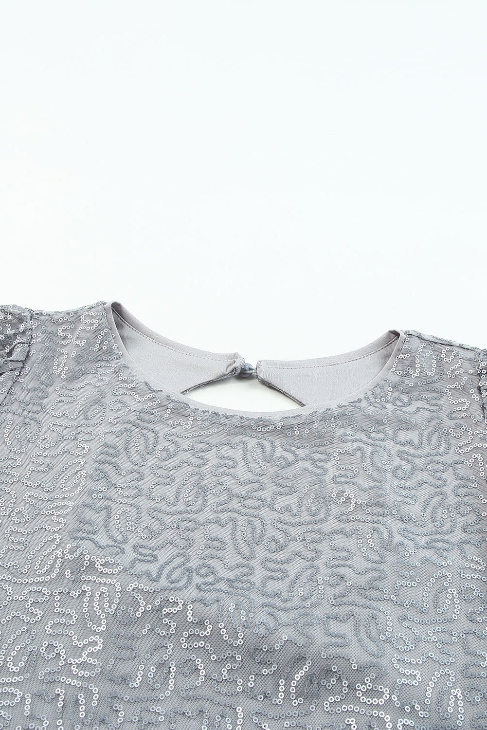 Grijze mesh blouse met ruchesmouwen en pailletten