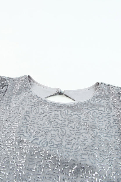 Grijze mesh blouse met ruchesmouwen en pailletten