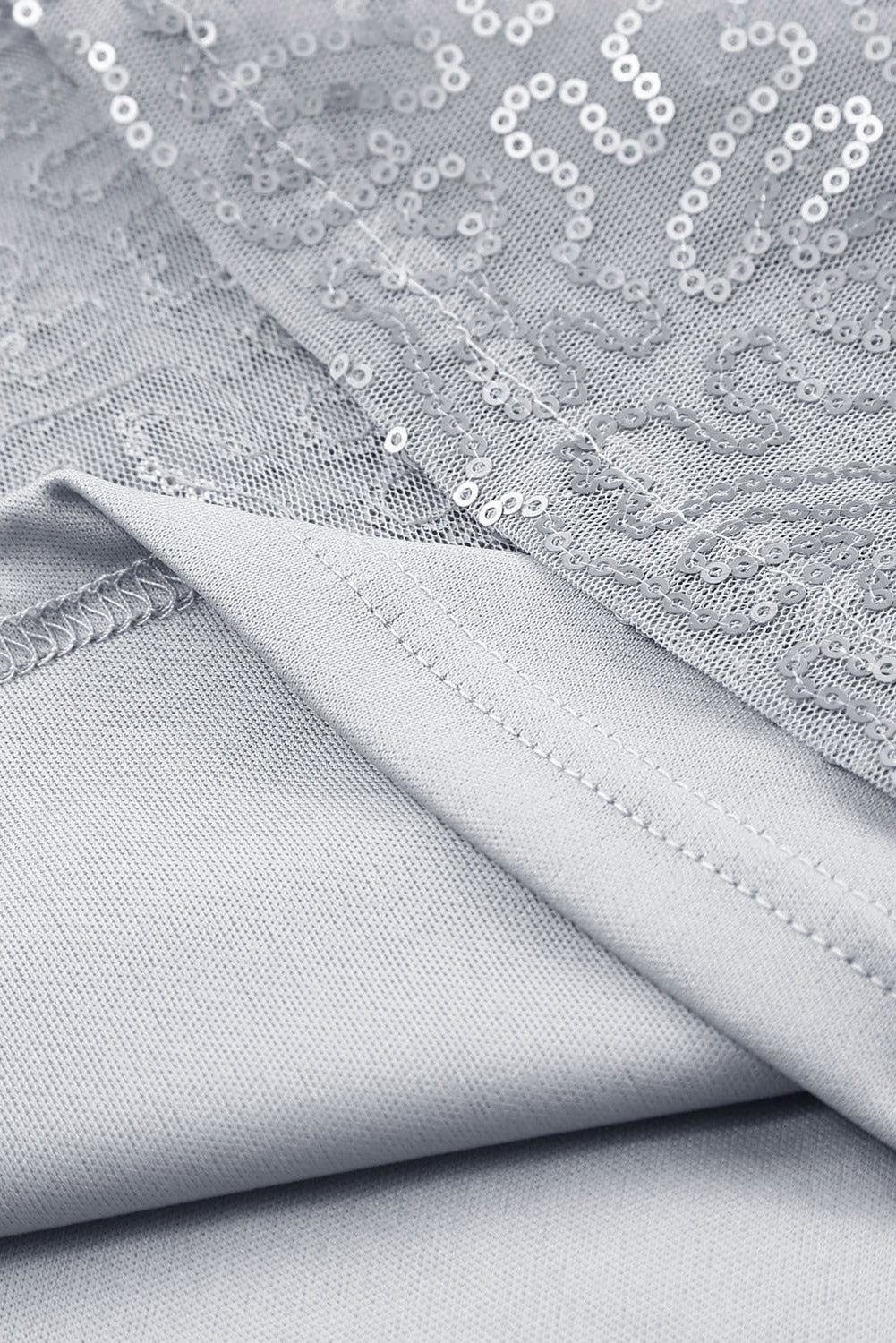 Grijze mesh blouse met ruchesmouwen en pailletten