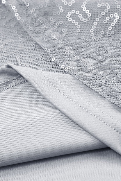Grijze mesh blouse met ruchesmouwen en pailletten
