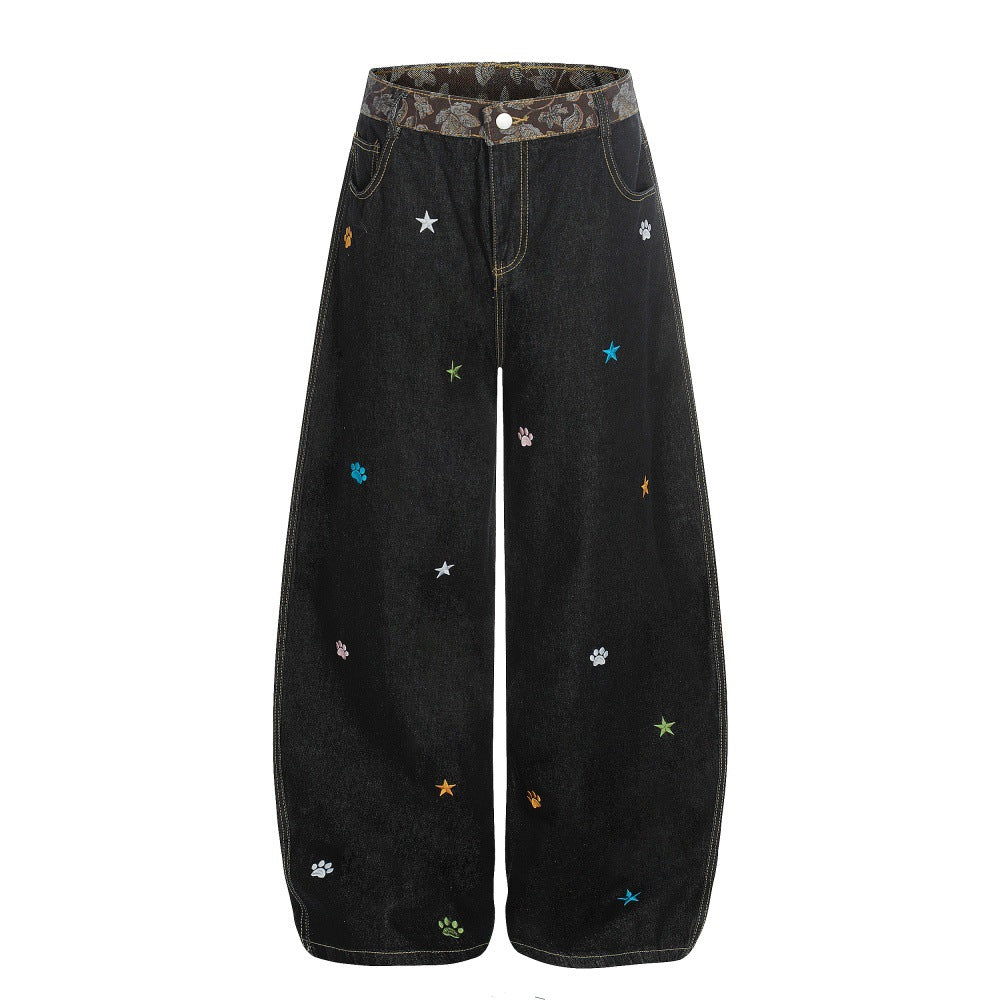 Jeans met gebogen mes vorm en geborduurd sterrenhemelmotief