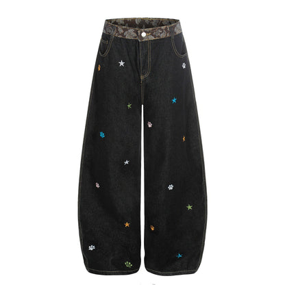 Jeans met gebogen mes vorm en geborduurd sterrenhemelmotief