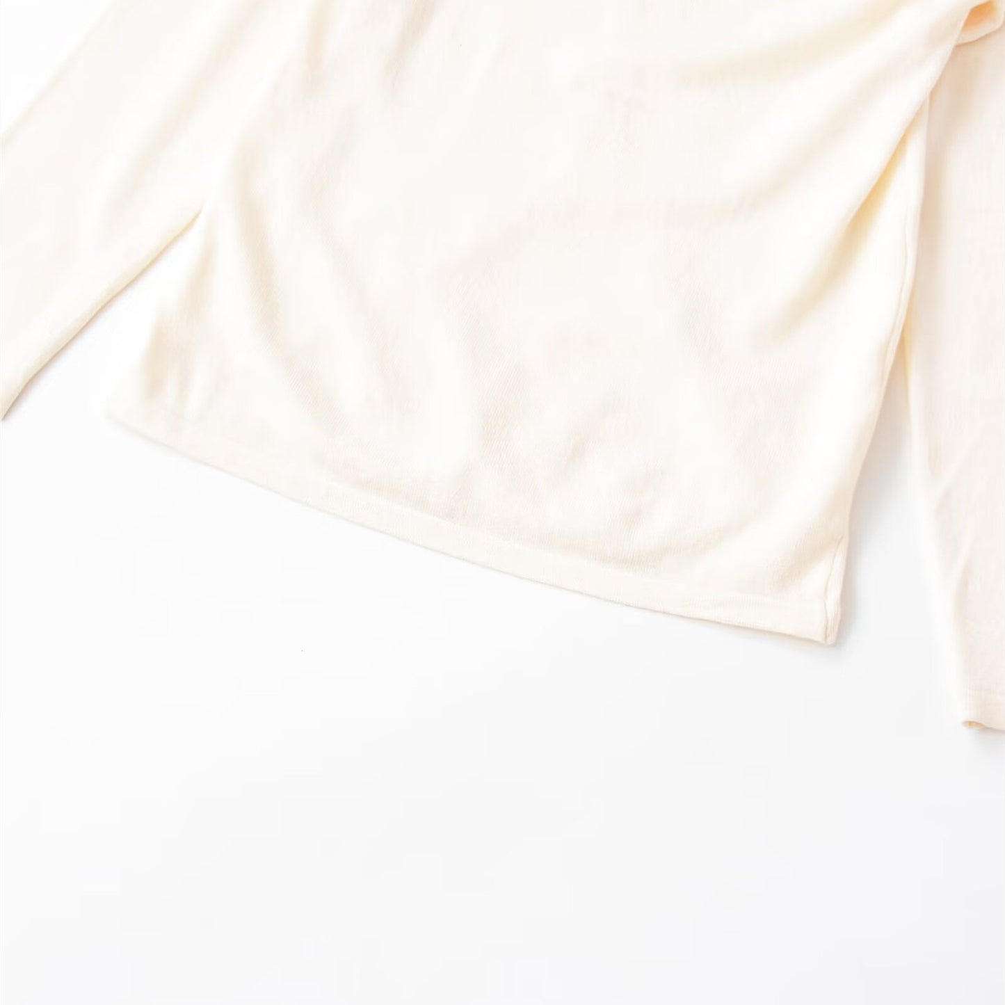 Top met onregelmatig patroon lange mouwen en plooien