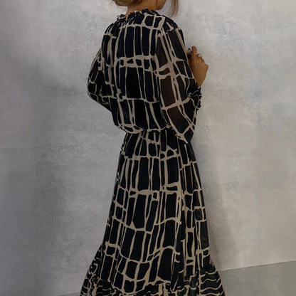 Elegante jurk met lange mouwen print getailleerde pasvorm en uitlopende rok