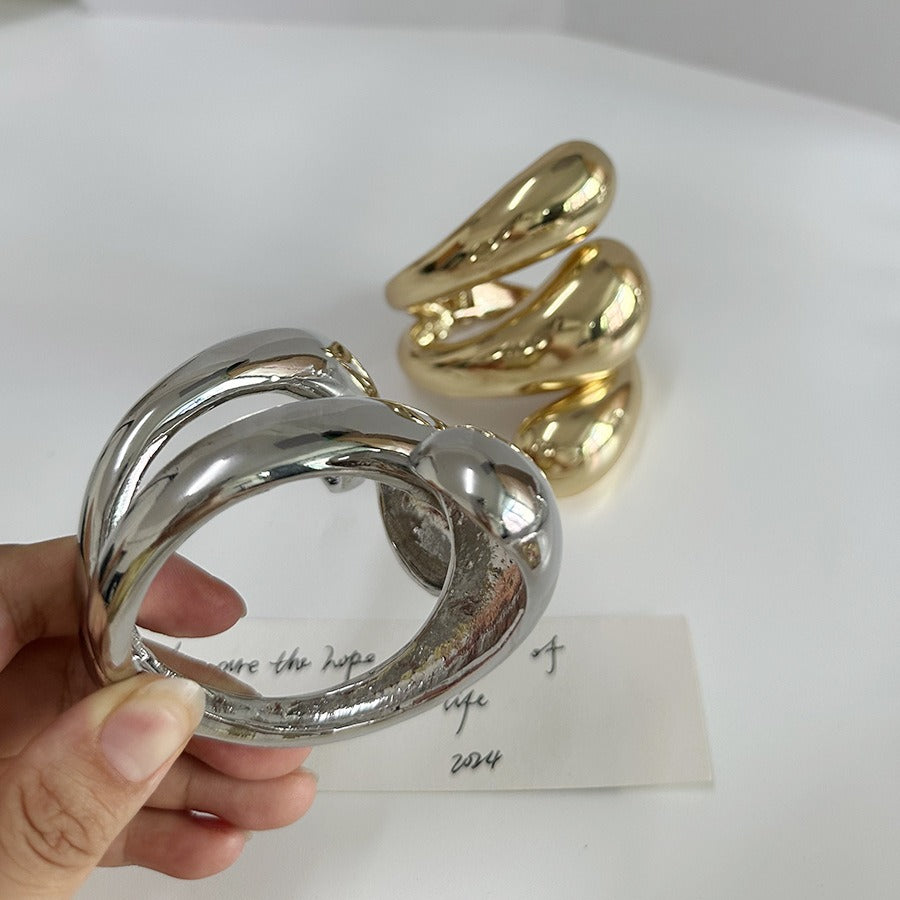 Geometrische high-end armband met spiraalvormige waterdruppelopening