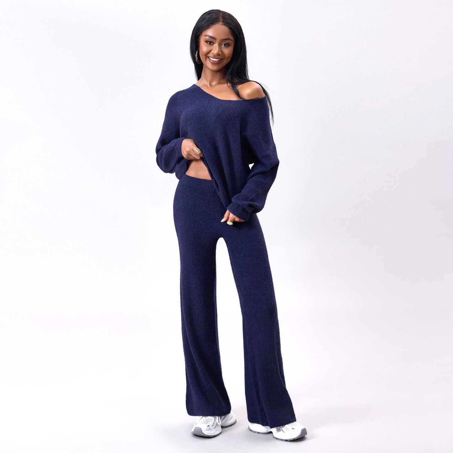 Gebreid geborsteld pak met lange mouwen en verzonken strepen