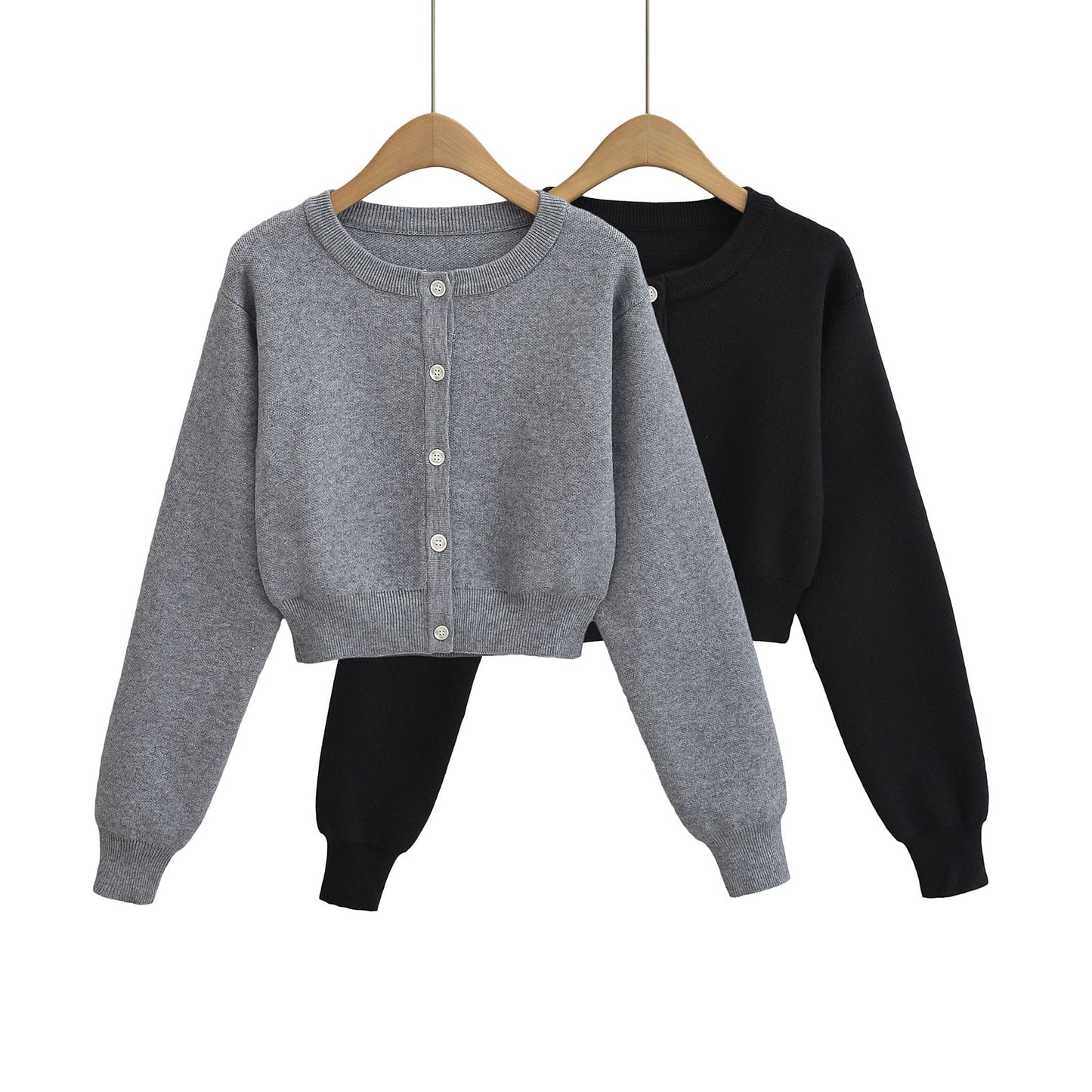Korte vest met ronde hals lange mouwen en knopen