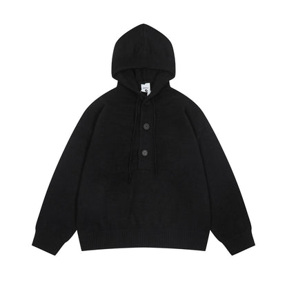 Tui met halve knoopsluiting en capuchon