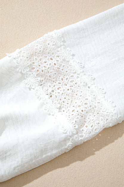Witte blouse met lange mouwen bloemenmotief guipure kant en ruches