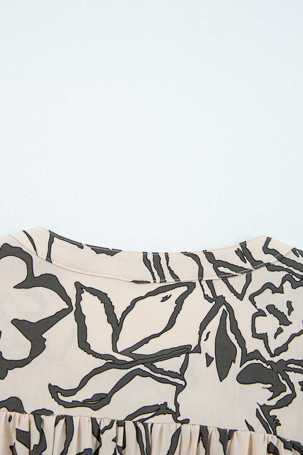 Losse blouse met bloemenprint vleermuismouwen en knoopsluiting