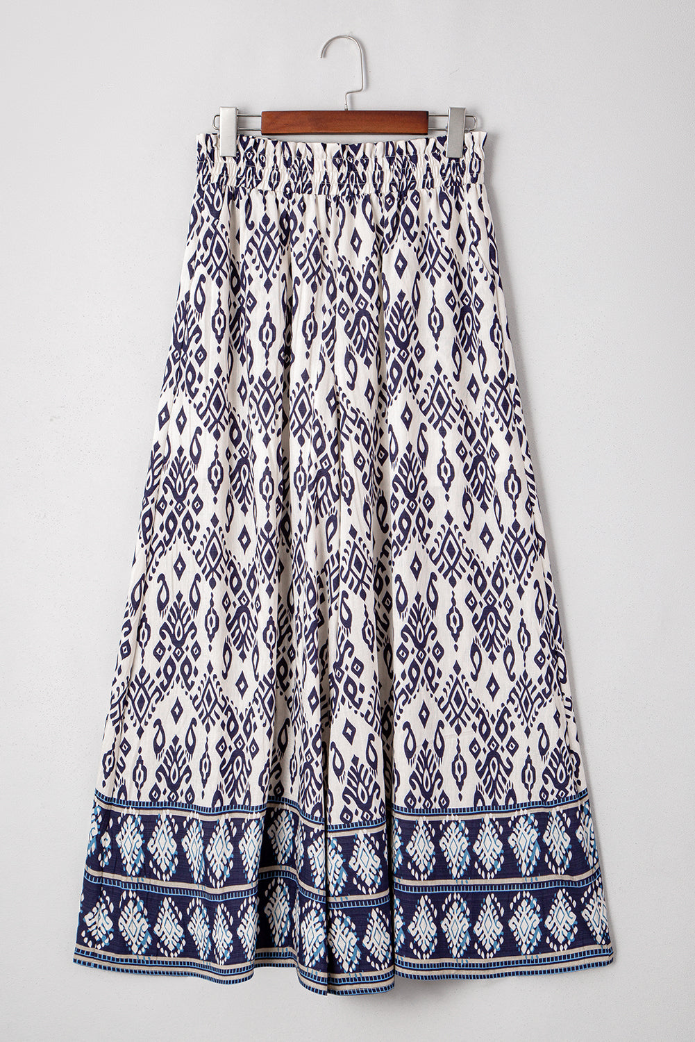 Blauwe broek met etnische print hoge taille en wijde pijpen losse pasvorm