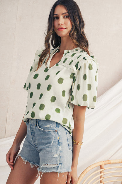 Blouse met stippenprint gesmokte halslijn en korte ballonmouwen
