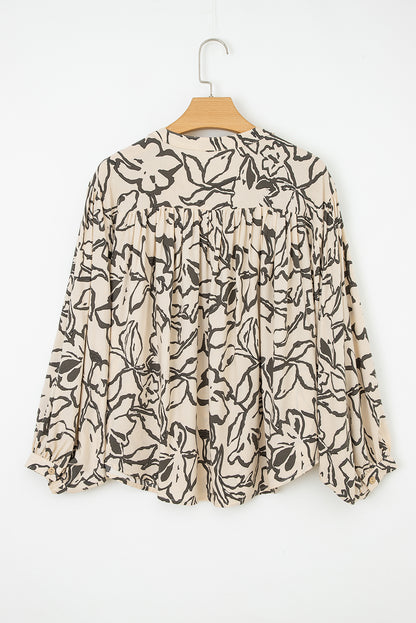 Losse blouse met bloemenprint vleermuismouwen en knoopsluiting