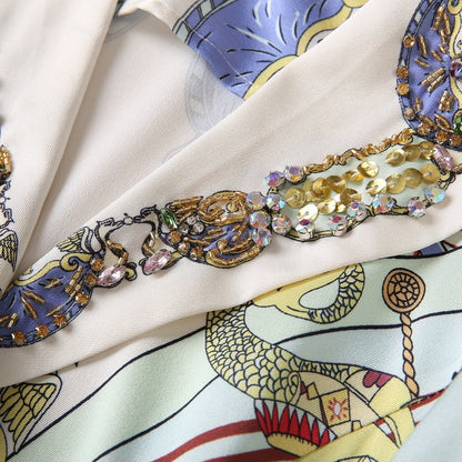 Jurk met korte mouwen en enkelrijs versierd met een circusprint en pailletten