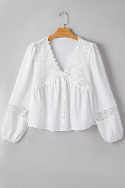 Witte blouse met lange mouwen bloemenmotief guipure kant en ruches