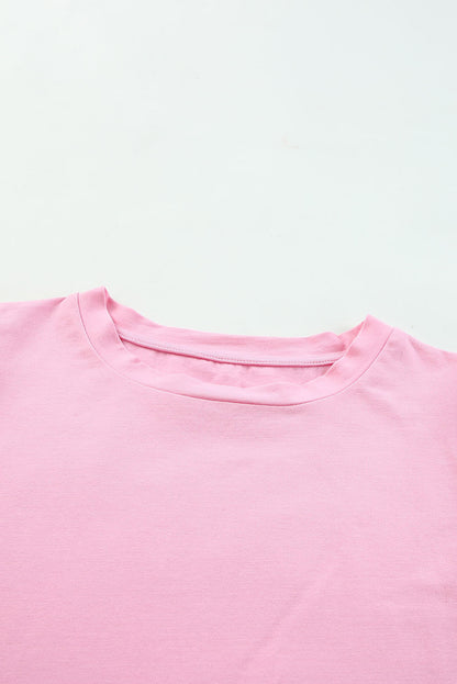 Roze top van tule met pofmouwen