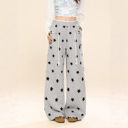 Dames joggingbroek met all-over sterren print wijde pijpen in een relaxte stijl