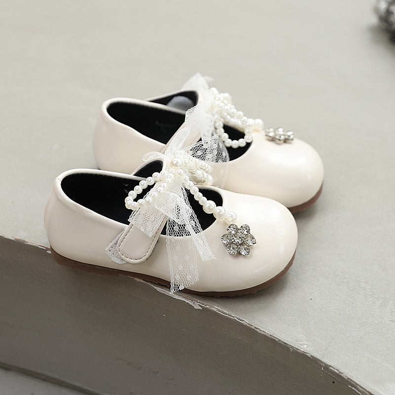 Sweet bow-adorned little leather shoes