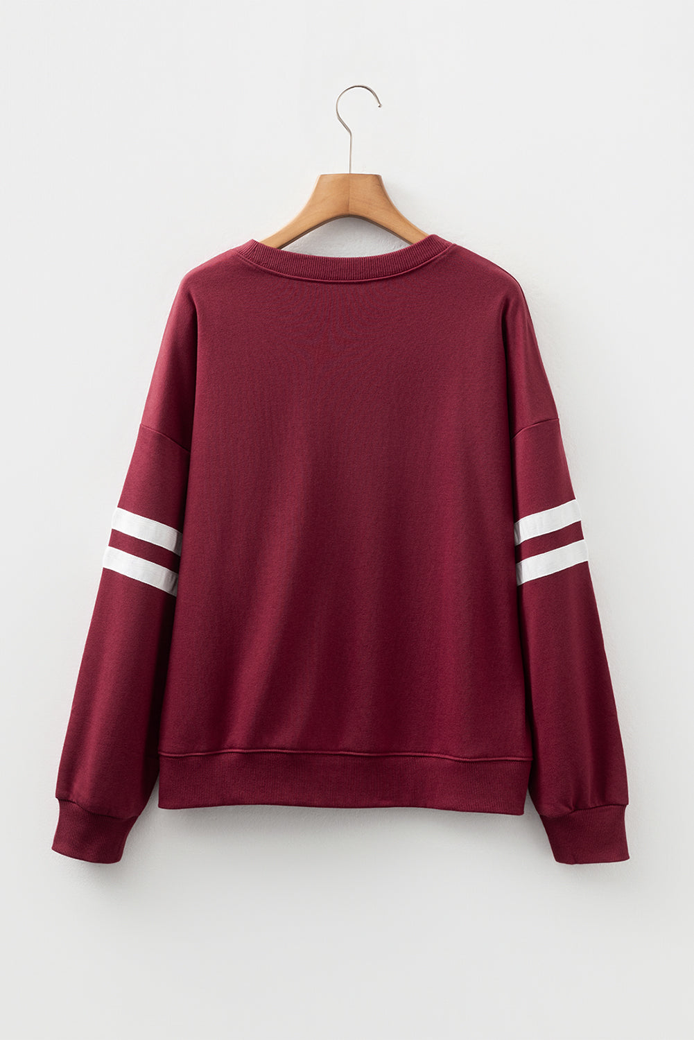 Preppy sweatshirt met strepen op de mouwen en een losse pasvorm