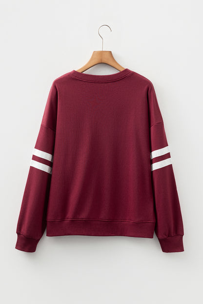 Preppy sweatshirt met strepen op de mouwen en een losse pasvorm