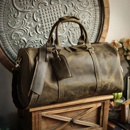 A men's hand-held outdoor camping travel bag made of cowhide