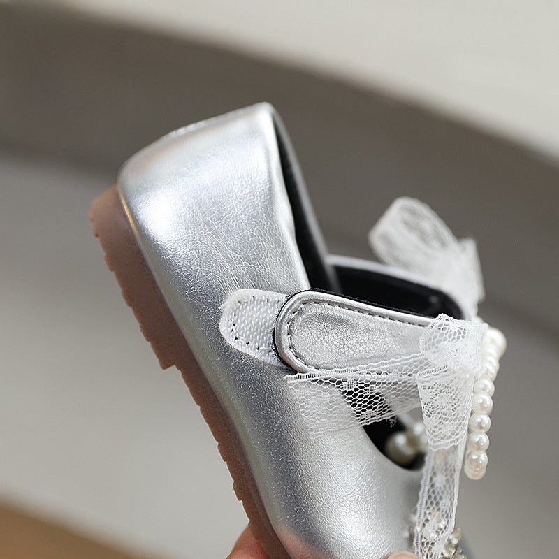 Sweet bow-adorned little leather shoes