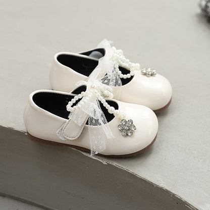 Sweet bow-adorned little leather shoes
