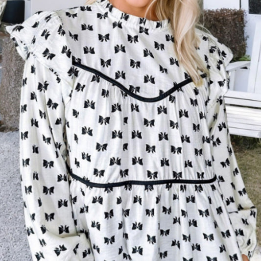 Witte blouse met bies strikprint en ronde hals