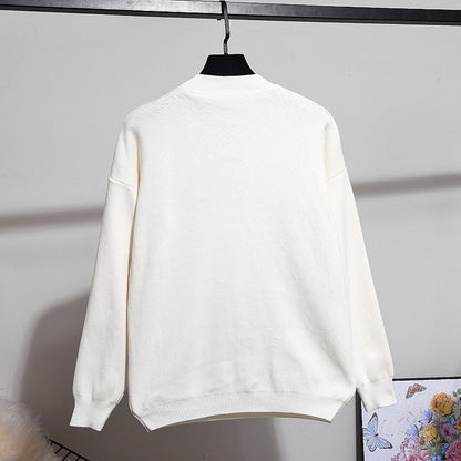 Damesset van gebreide trui en broek met paillettenborduursel