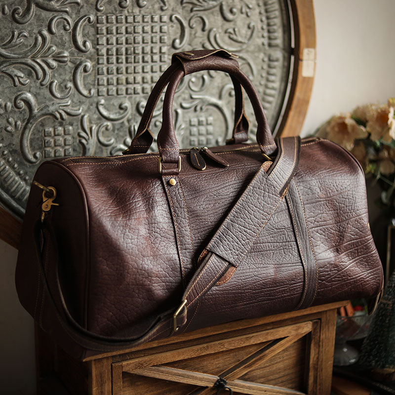 A men's hand-held outdoor camping travel bag made of cowhide