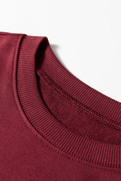 Preppy sweatshirt met strepen op de mouwen en een losse pasvorm