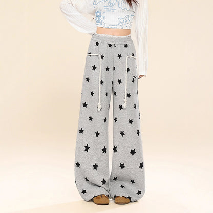 Dames joggingbroek met all-over sterren print wijde pijpen in een relaxte stijl