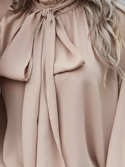 Blouse met strik in de hals en pofmouwen