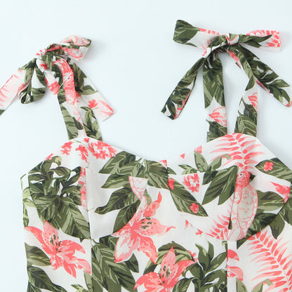 Getailleerde jurk met bloemenprint ceintuur en strikbandjes