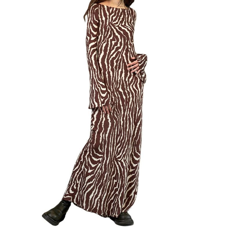 Lange jurk met zebraprint en lange wijd uitlopende mouwen