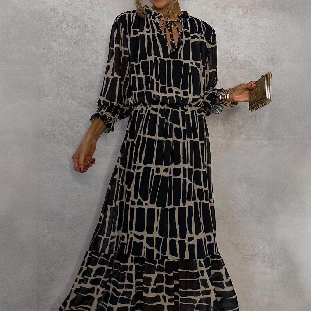 Elegante jurk met lange mouwen print getailleerde pasvorm en uitlopende rok
