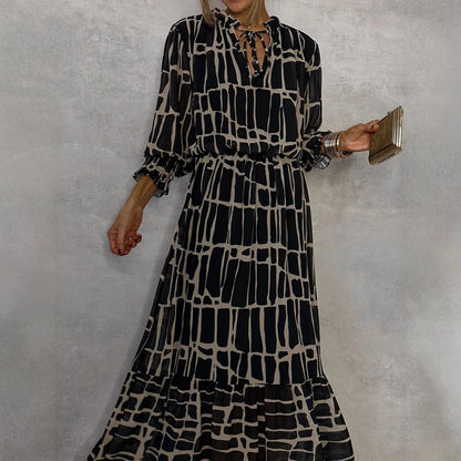 Elegante jurk met lange mouwen print getailleerde pasvorm en uitlopende rok