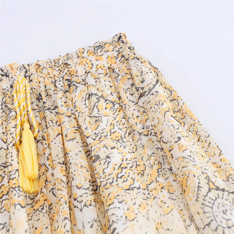 Elegant vormgegeven shirttop of midi-rok met print