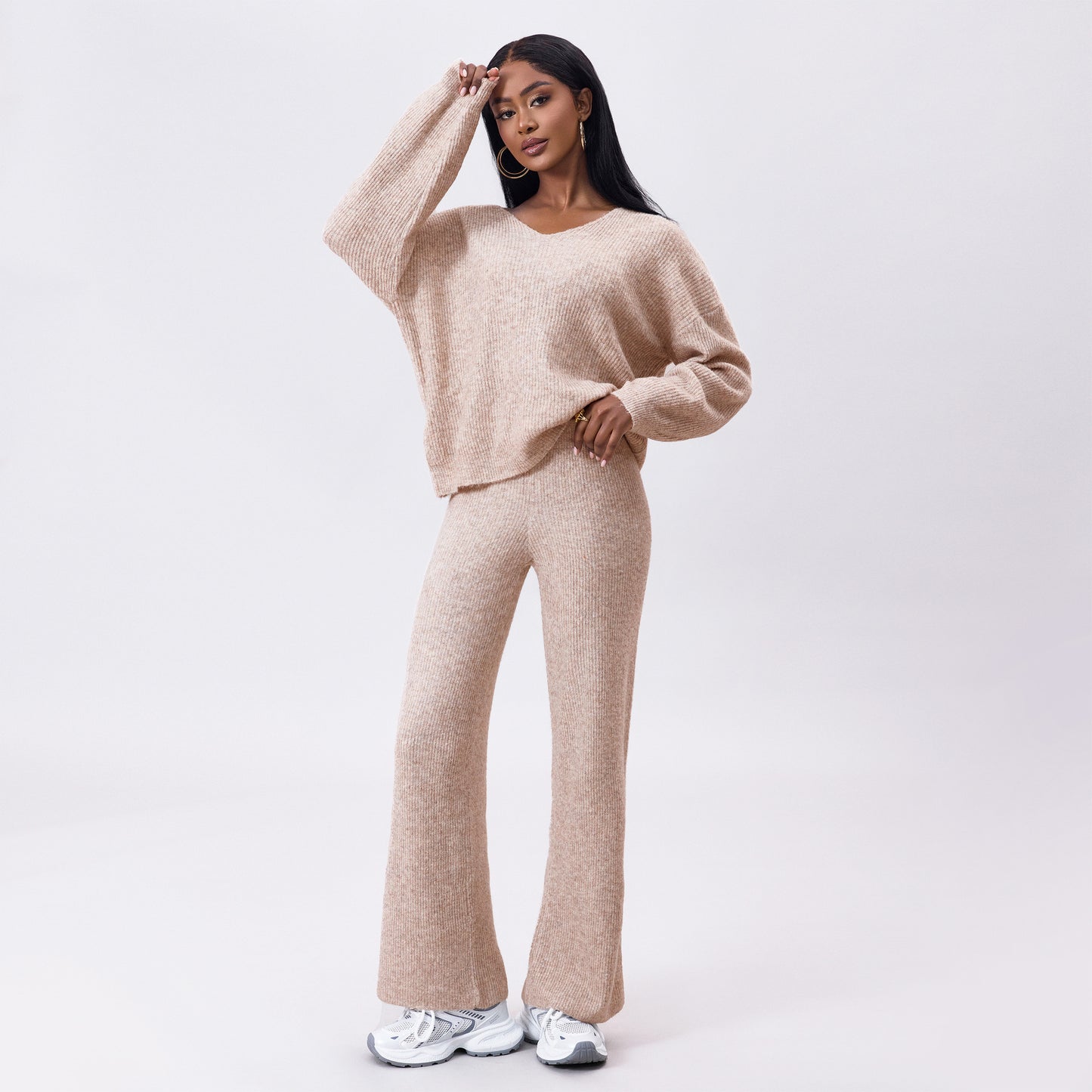 Gebreid geborsteld pak met lange mouwen en verzonken strepen